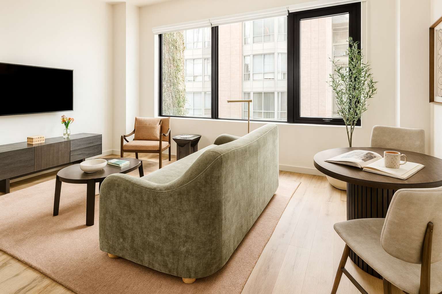 Cozy lounge and cafe area with olive-green banquette seating at Nester St. Lawrence Market in St. Lawrence Market, Toronto