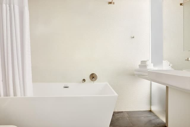 Spacious apartment living room with contemporary furnishings at Nester Entertainment District in Entertainment District, Toronto