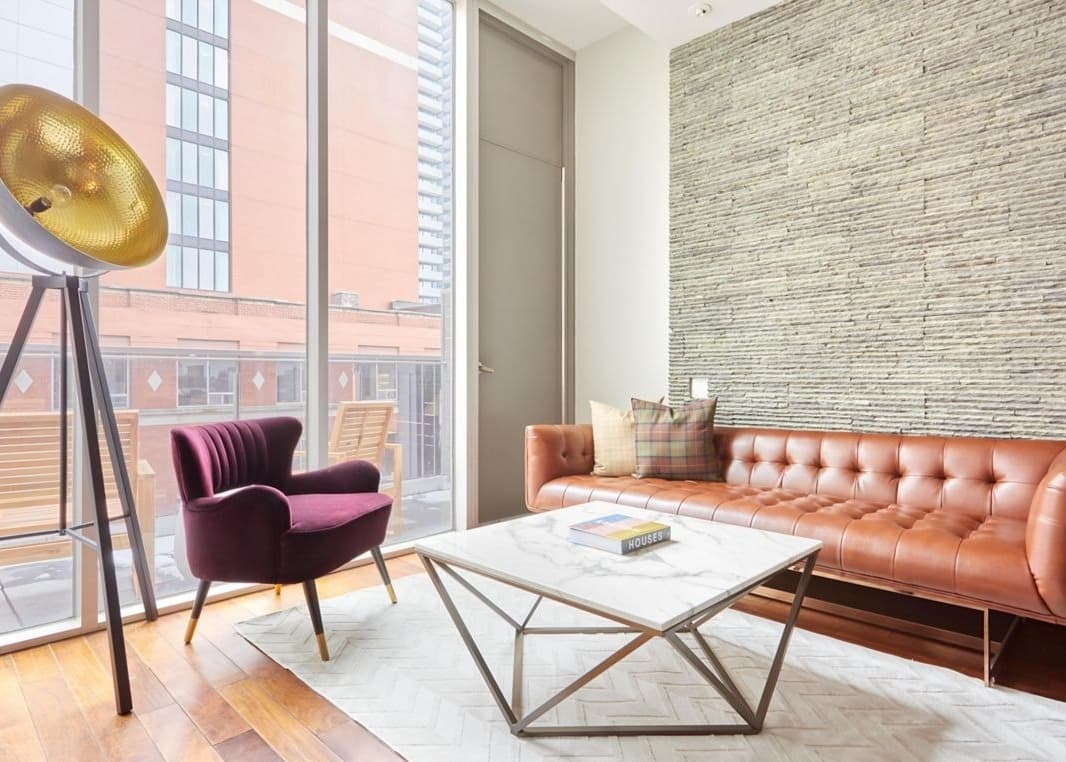 Cozy lounge and cafe area with modern seating at Nester Entertainment District in Entertainment District, Toronto