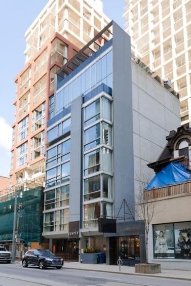 Guest room interior at Nester Entertainment District with contemporary furnishings and city views in Entertainment District, Toronto